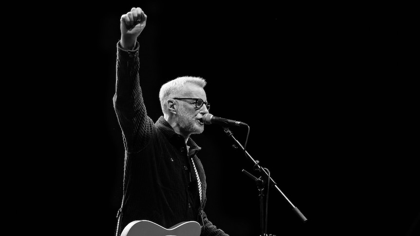Billy Bragg on stage in 2023. Credit: Theo Michael