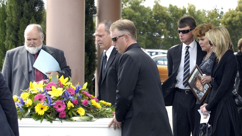 Maree Blacker's coffin is loaded into a hearse