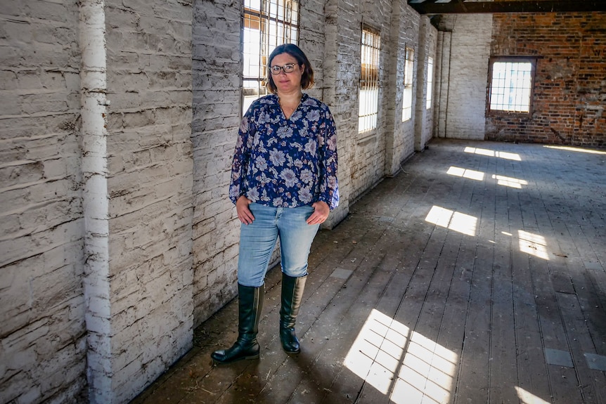 Lee-Ann Elmes stands in the empty warehouse that will be her youth centre
