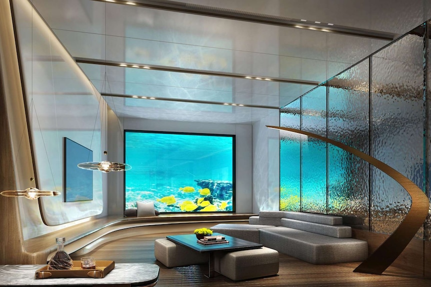 A hotel suite with an aquarium outlook.