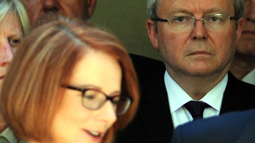 Julia Gillard with Kevin Rudd glaring behind, March 5 2013