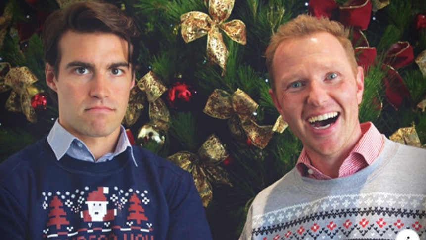 Two men wearing Christmas jumpers in a Red Cross blood donation ad.