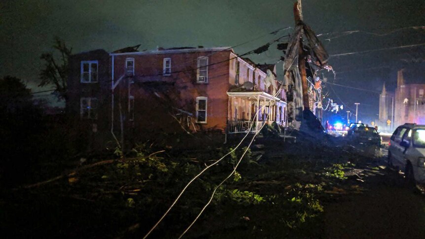 A powerline is down in front  of a ruined building in tornado-hit Jefferson City.