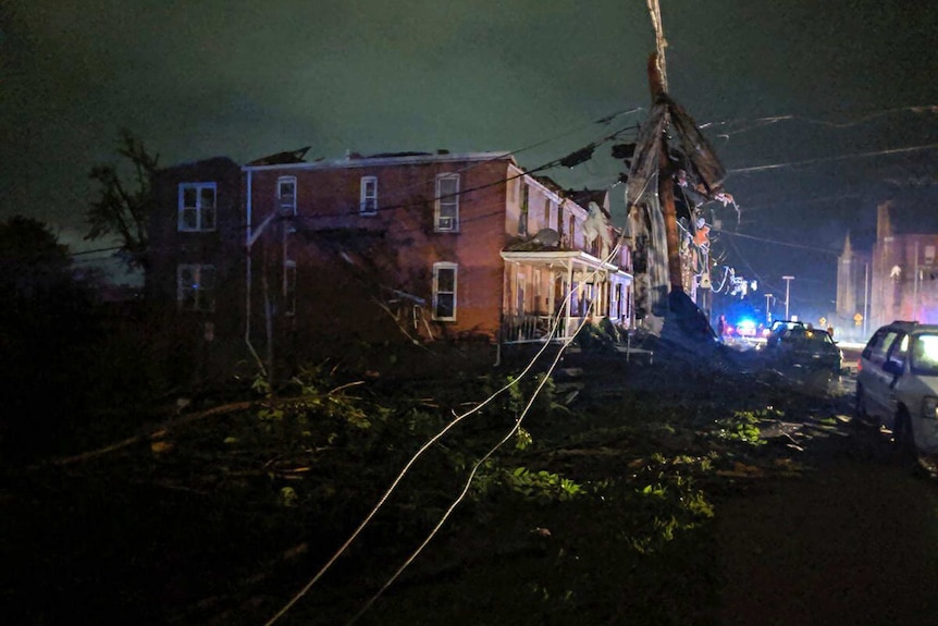 A powerline is down in front  of a ruined building in tornado-hit Jefferson City.