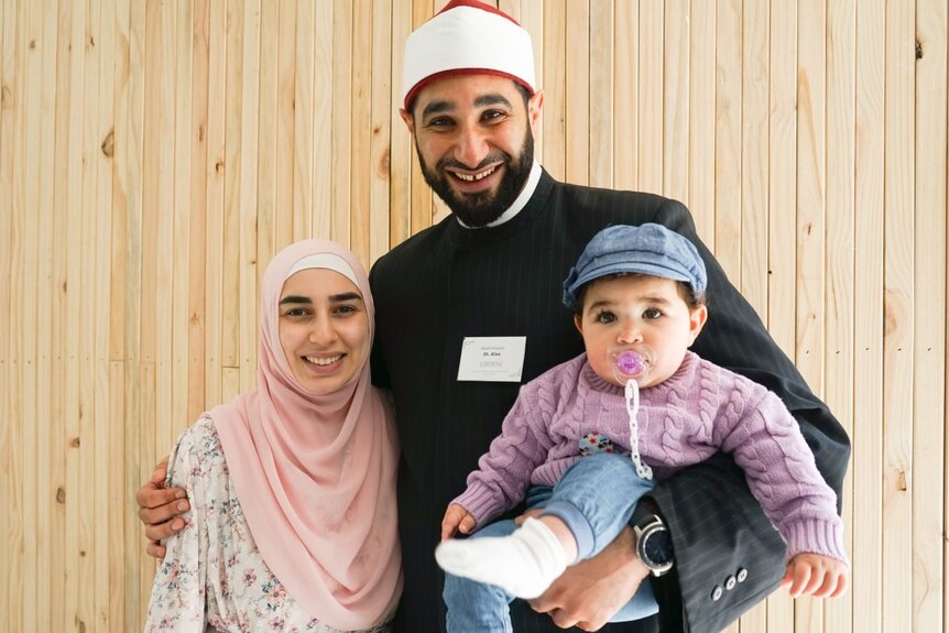 Picture of two people who host guided tours at the mosque.