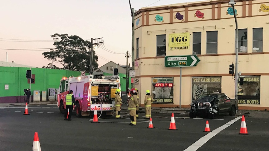 Emergency services at the scene of a fatal crash between a four-wheel drive and a sedan at St Peters.