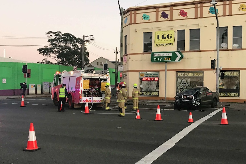 Emergency services at the scene of a fatal crash between a four-wheel drive and a sedan at St Peters.