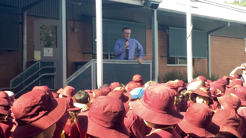 Heaton Public School principal Brian Meek addresses school students.