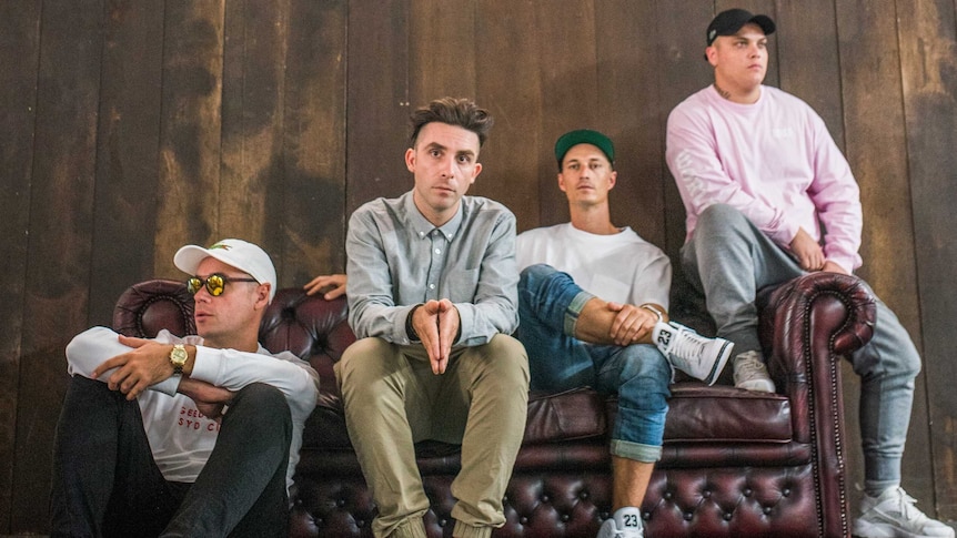 Picture of Thundamentals sitting on a red couch