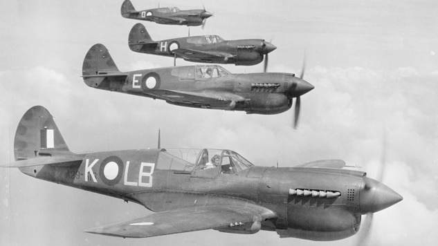 Four kittyhawk fighter planes patrol the skies over Horn Island in the Torres Strait during World War II.