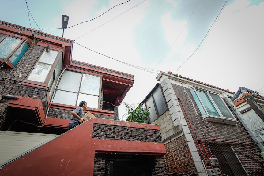 A man walks up stairs.