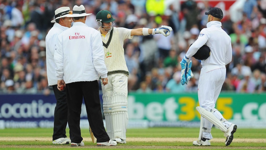 Michael Clarke discusses the bad light call with the umpires at the Ashes