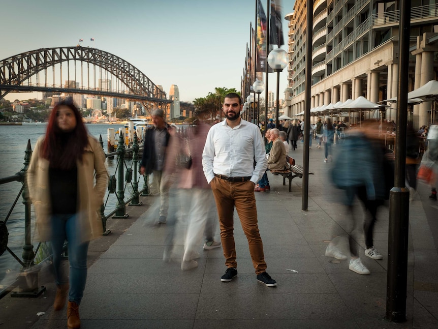 Fadi Chalouhy standing in front of the Harbour Bridge.