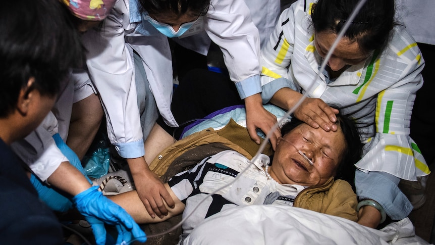 Medical workers treat a woman after an earthquake in Yangbi Yi Autonomous County in southwestern China's Yunnan Province.