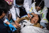Medical workers treat a woman after an earthquake in Yangbi Yi Autonomous County in southwestern China's Yunnan Province.
