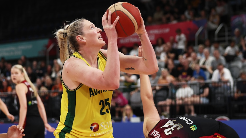 Lauren Jackson looks up with ball in hand under pressure from an opponent