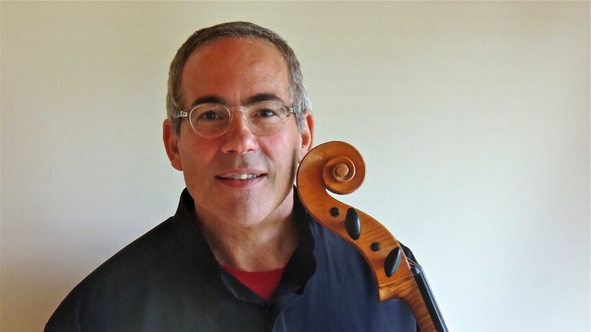 A photo of Michael Goldschlager with his cello.