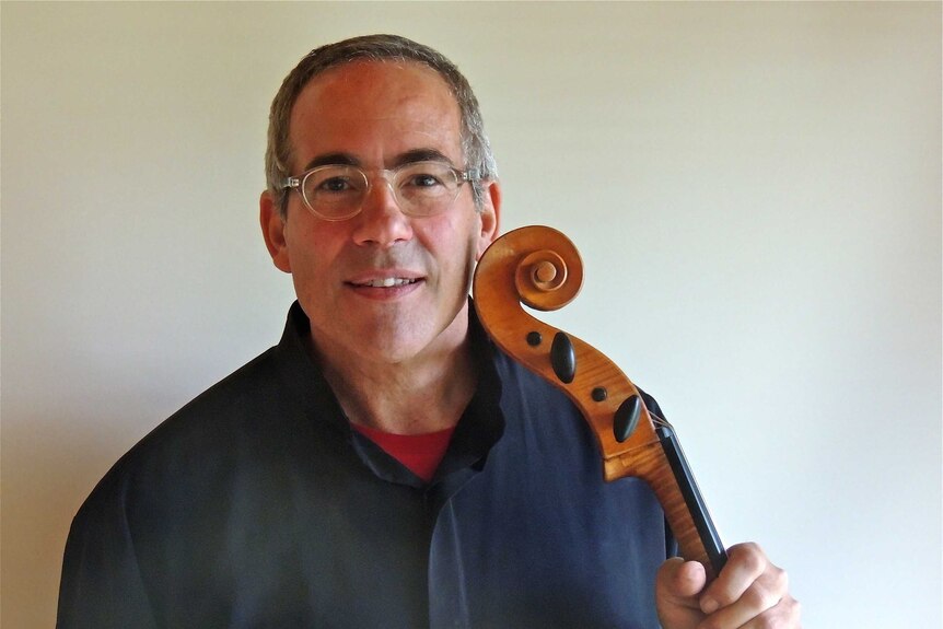 A photo of Michael Goldschlager with his cello.