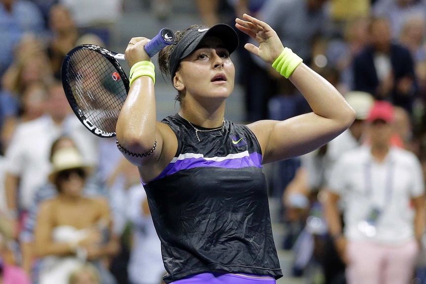 Bianca Andreescu holds her hands to her head