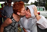 Pauline Hanson kisses Jo-Ann Miller while campaigning in Ipswich for the 2017 state election.
