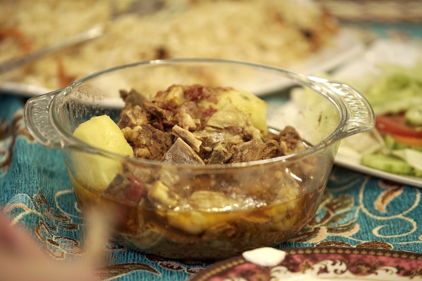 Brown and yellow food in a class bowl