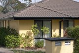 Photo showing two small houses built on one block of land at Ainslie in Canberra.