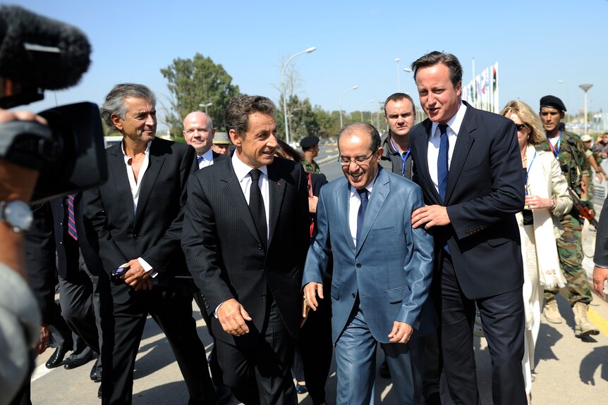 French president Nicolas Sarkozy, NTC prime minister Mahmud Jibril and Britain's prime minister David Cameron