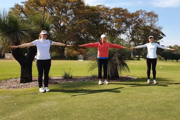 A professional female golfer practises social distancing with junior girls from a Perth golf club.