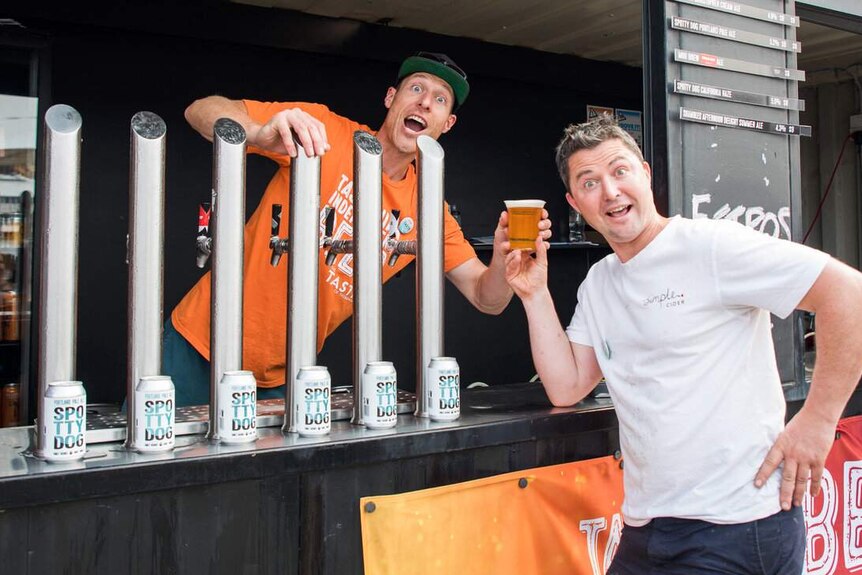 Two men at a Spotty Dog beer stall at Taste of Tasmania 2019.