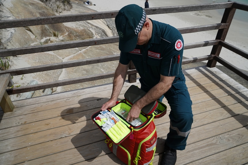 A paramedic with bag of gear