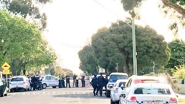 Police block off Hanson Road in Craigieburn as they investigate a reported shooting
