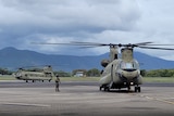 a chinook helicopter on the runway