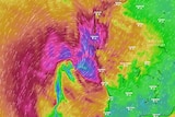 A radar image of WA with a big purple rain band near the coast.