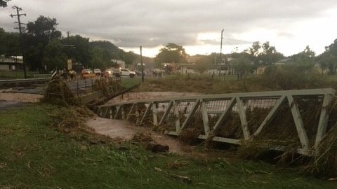 Floodwaters damaged this footbridge at Springsure in Central Queensland after more than 150mm of rain fell early this morning.