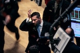 A trader reacts to the stockmarket figures on the floor of the New York Stock Exchange