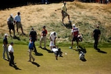 Australia's Jason Day lays on the ninth hole at the US Open after being overcome by dizziness.