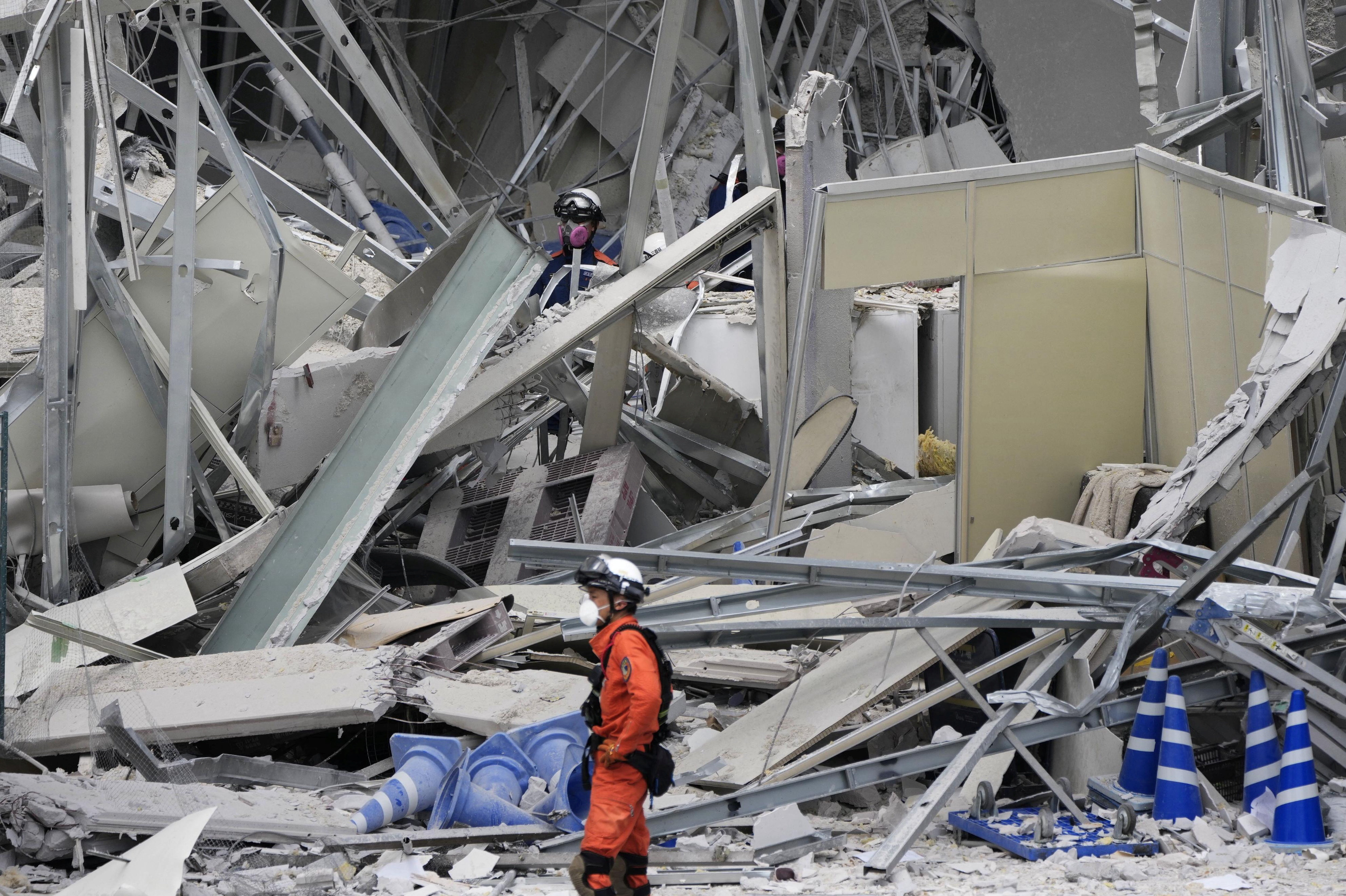More earthquake warnings in Japan as rescuers race to free those trapped