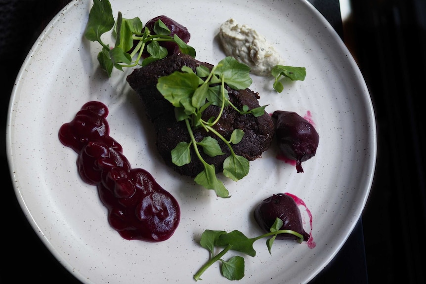 Wagyu beef cheek main with beetroot and onion relish.