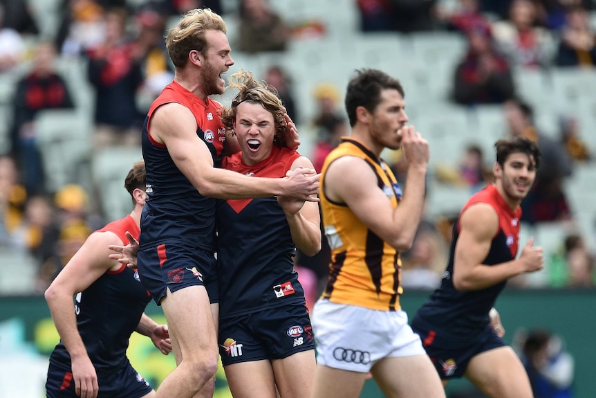 Jack Watts and Jayden Hunt celebrate a goal