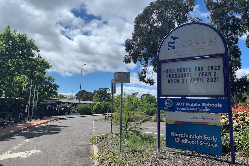 The entrance to a school, with an enrolments sign.