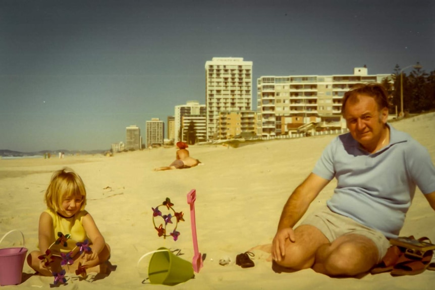 Nicola Gobbo and her father play on a beach.