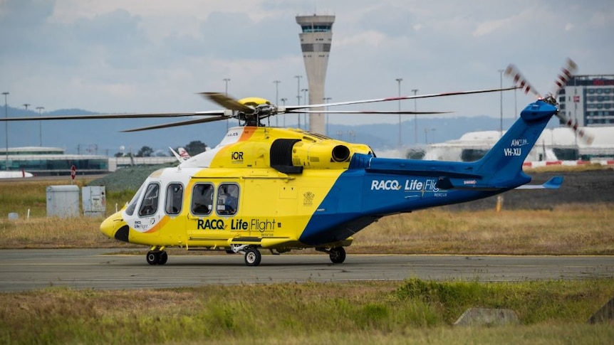 A LifeFlight helicopter on the tarmac of Brisbane Airport.