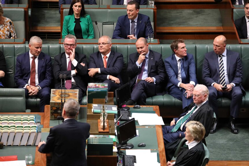Scott Morrison and Government ministers sit disinterested on the frontbench while Bill Shorten speaks.