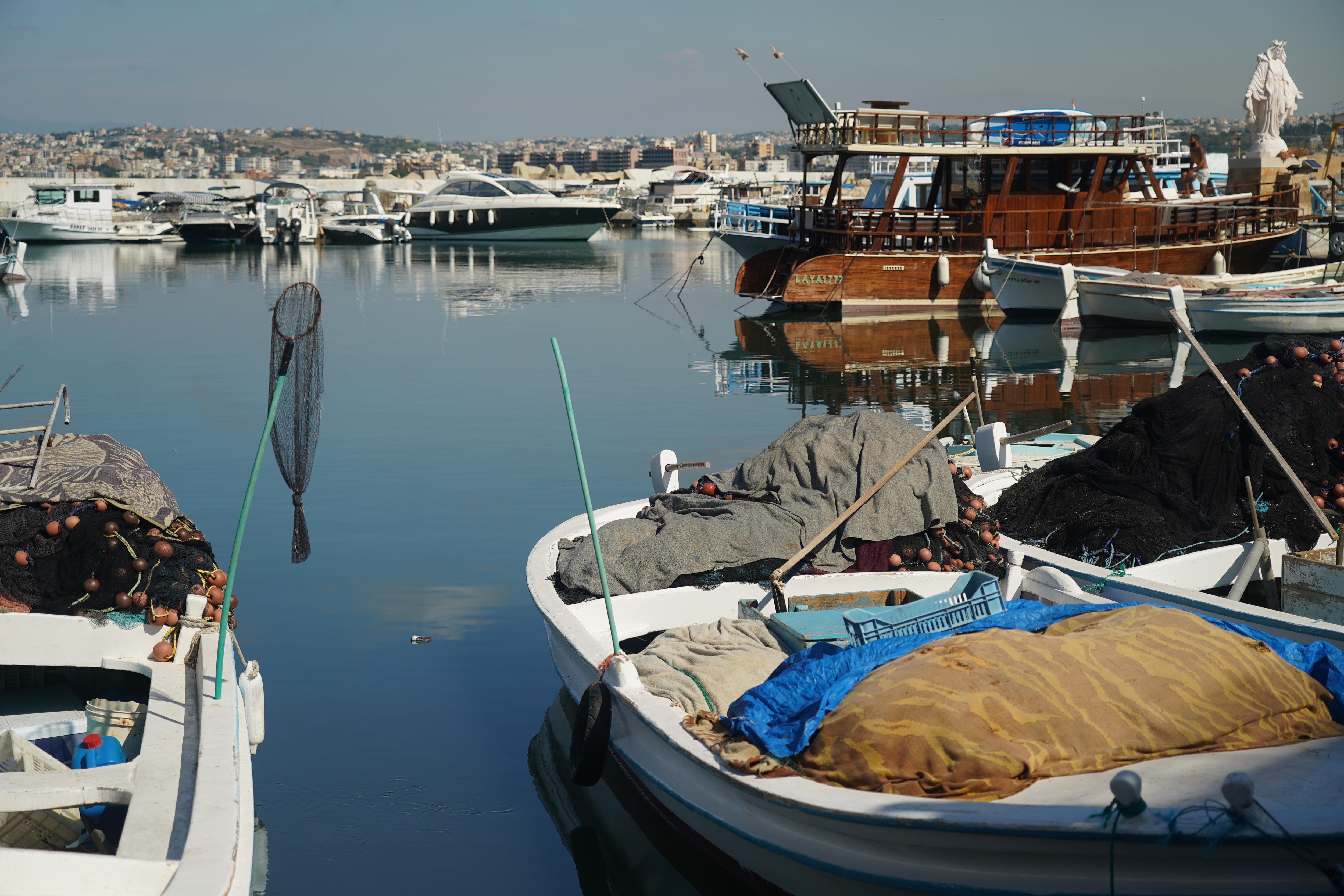 fishing boats unused at a wharf