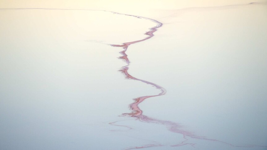 White salt and red coloured light make patterns on Lake Eyre North.