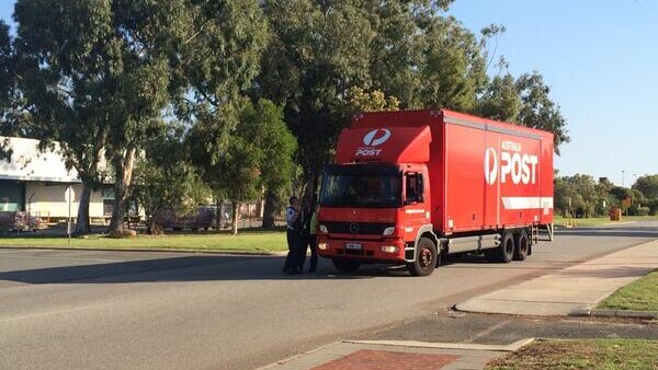 Australia Post truck leaves site where suspicious packages found in Perth