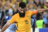 Socceroos' Mile Jedinak slots home a penalty against Honduras