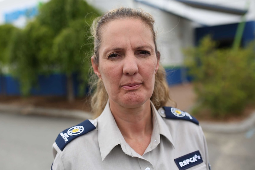 RSPCA Chief Inspector Amanda Swift in her uniform outside the Association's offices