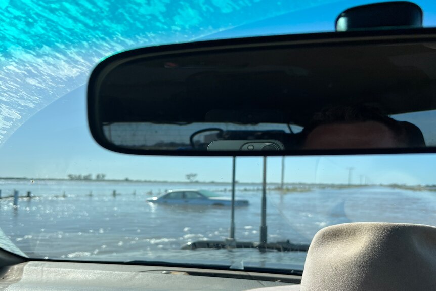flooded road and car
