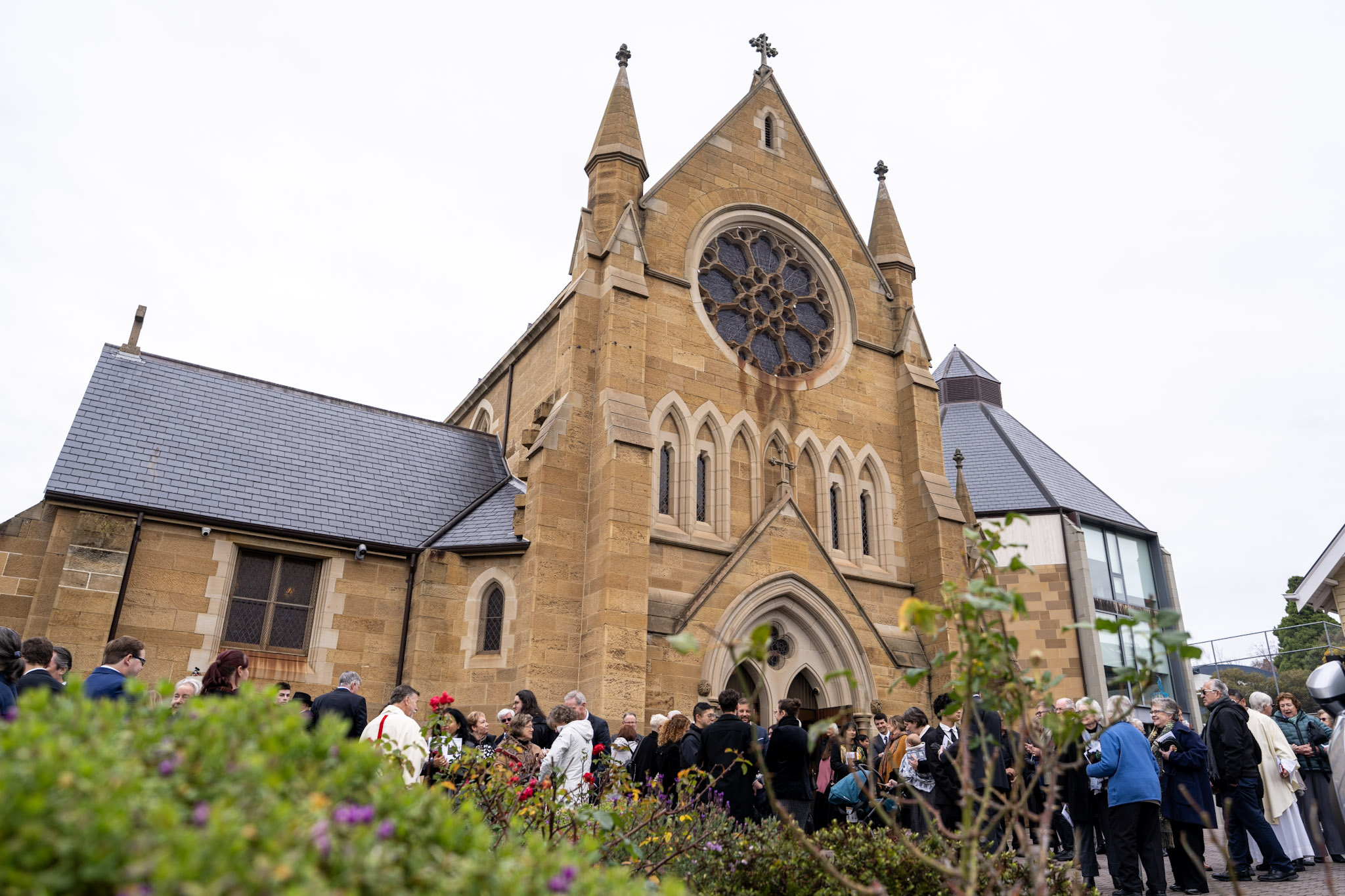 A crowd of people standing outside St Mary's Cathedral.